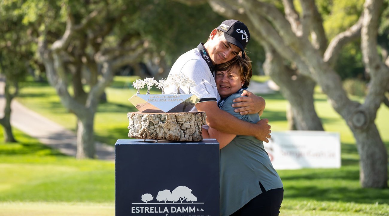 Christiaan Bezuindehout hugs his mother during the prize-giving ceremony of the Estrella Damm N.A. Andalucía Masters (credit © Real Club Valderrama)